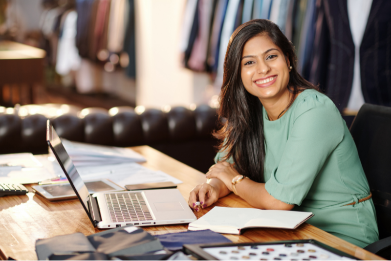 smiling business woman with laptop